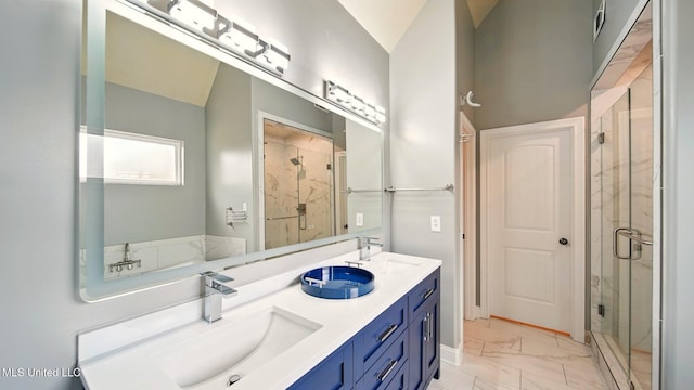 full bathroom featuring marble look tile flooring, a shower stall, and double vanity