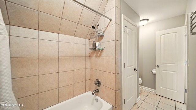 full bathroom featuring tile patterned floors, shower / tub combo, toilet, and baseboards