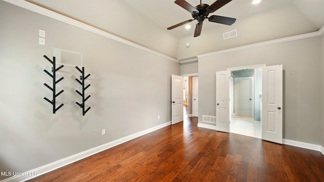unfurnished bedroom featuring high vaulted ceiling, baseboards, wood finished floors, and ceiling fan