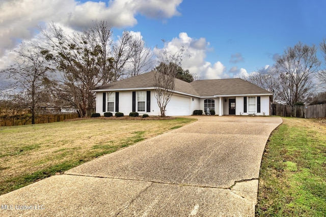 single story home featuring a garage and a front lawn