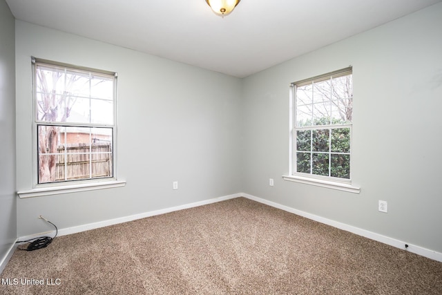 spare room featuring carpet