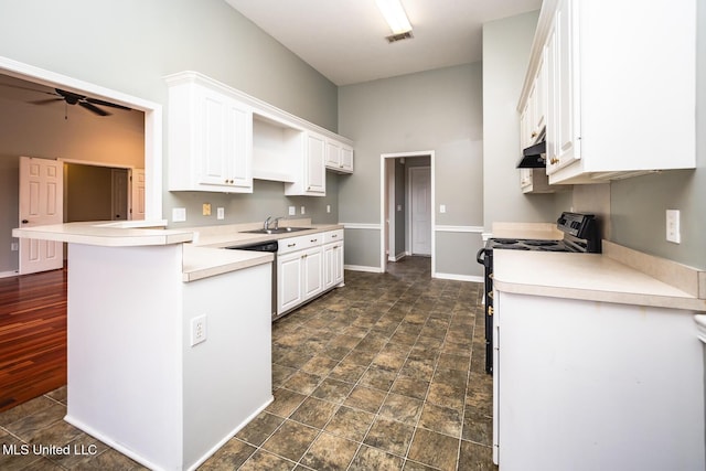 kitchen with white cabinetry, black stove, ceiling fan, kitchen peninsula, and a breakfast bar area