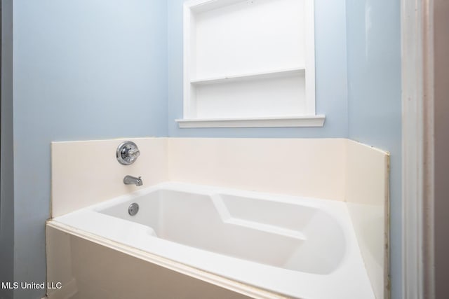 bathroom with tiled tub