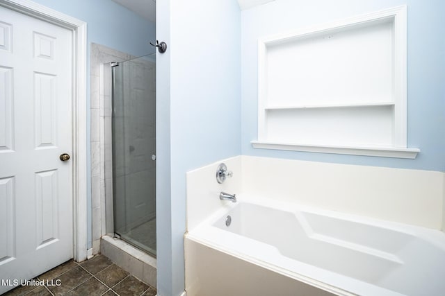 bathroom featuring tile patterned flooring and plus walk in shower