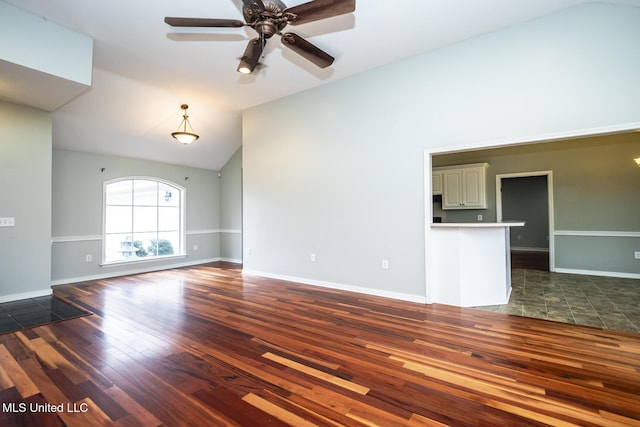 unfurnished living room with dark hardwood / wood-style floors, ceiling fan, and high vaulted ceiling