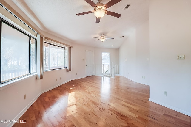 spare room with ceiling fan and light hardwood / wood-style flooring