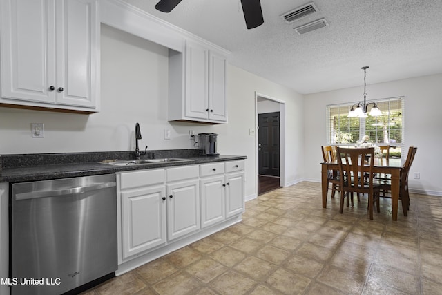 kitchen with stainless steel dishwasher, a sink, ceiling fan with notable chandelier, and visible vents