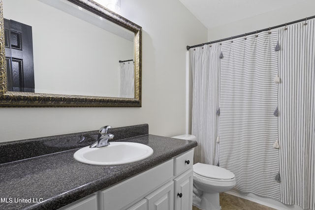 bathroom with vanity, tile patterned floors, a shower with curtain, and toilet