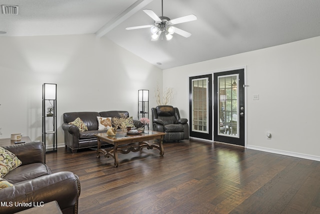 living area featuring visible vents, wood finished floors, baseboards, ceiling fan, and lofted ceiling with beams