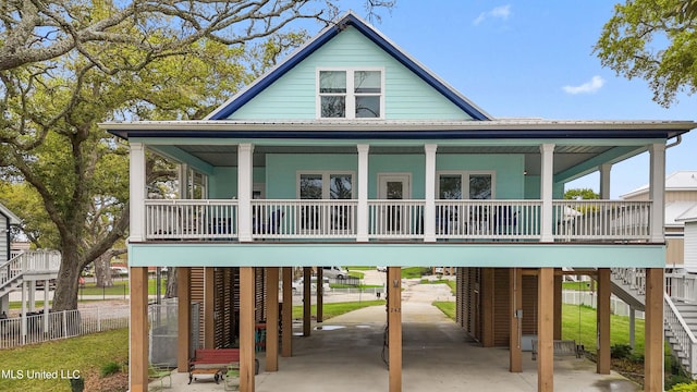 exterior space featuring covered porch and a carport