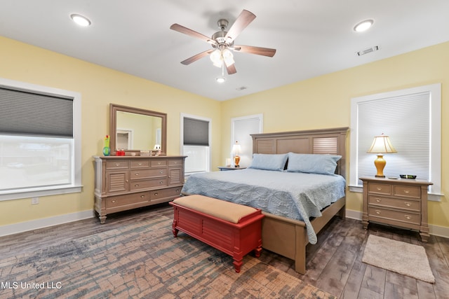 bedroom with dark wood-type flooring and ceiling fan