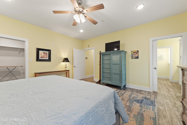 bedroom featuring ceiling fan and dark hardwood / wood-style flooring