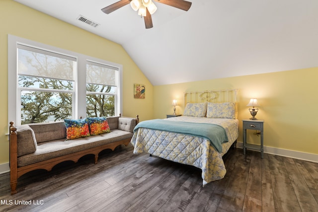 bedroom featuring dark wood-type flooring, ceiling fan, and vaulted ceiling