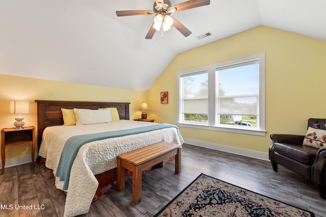 bedroom with lofted ceiling, dark hardwood / wood-style floors, and ceiling fan