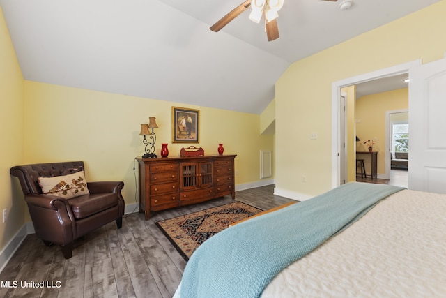 bedroom with lofted ceiling, hardwood / wood-style flooring, and ceiling fan