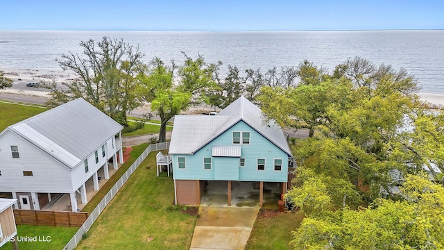 bird's eye view with a water view and a beach view