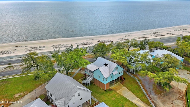 bird's eye view featuring a water view and a view of the beach