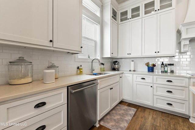 kitchen with white cabinetry, stainless steel dishwasher, dark hardwood / wood-style flooring, and sink