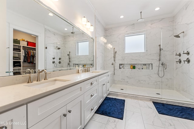 bathroom with ornamental molding, an enclosed shower, and vanity