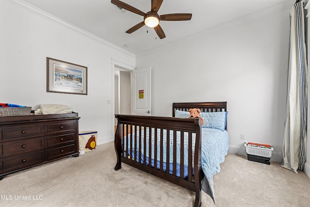 bedroom featuring ornamental molding, light colored carpet, and ceiling fan