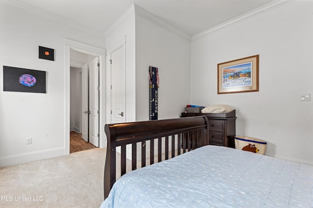 bedroom with crown molding and light carpet