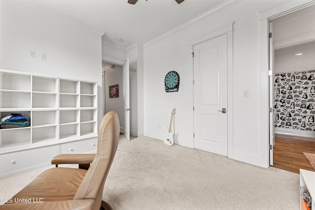 bedroom with ornamental molding, light colored carpet, ceiling fan, and ensuite bathroom