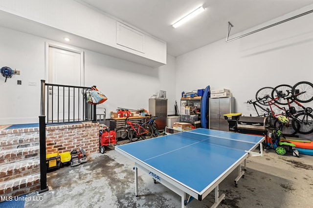 rec room featuring concrete flooring