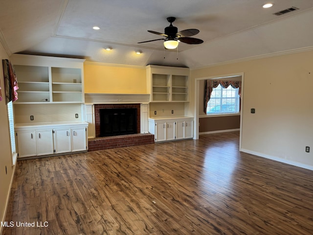 unfurnished living room featuring lofted ceiling, dark wood-type flooring, visible vents, and crown molding