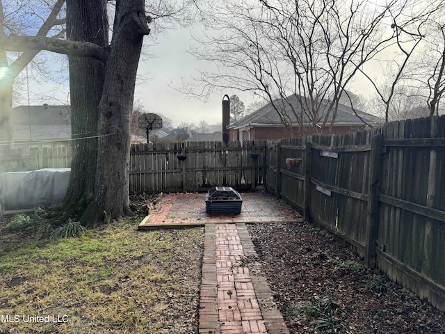 view of yard with an outdoor fire pit and a fenced backyard