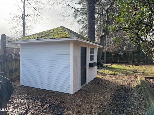 view of shed with fence