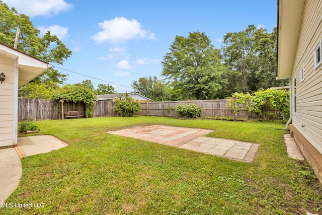 view of yard with a fenced backyard and a patio area