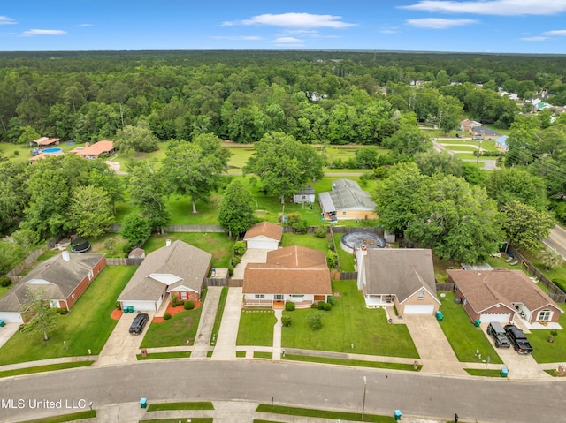 aerial view featuring a view of trees and a residential view