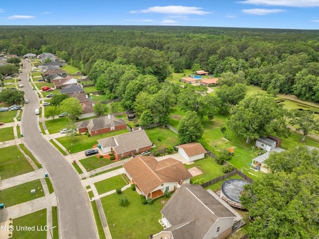 bird's eye view featuring a view of trees and a residential view