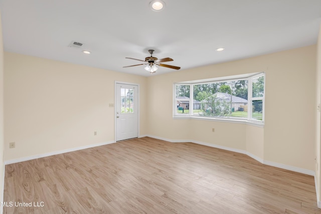 empty room featuring baseboards, ceiling fan, recessed lighting, and light wood-style flooring