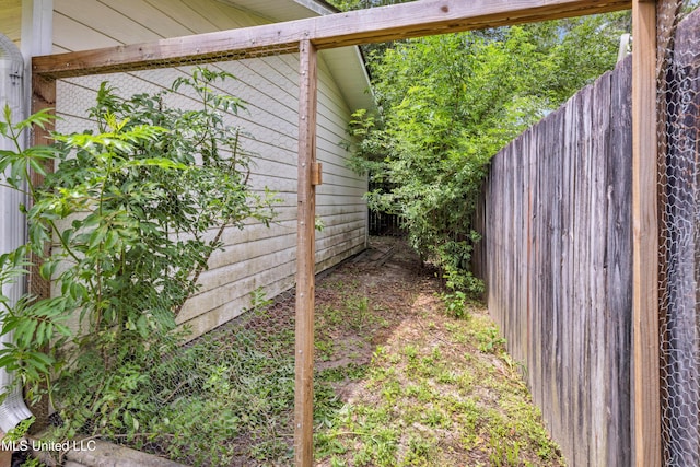 view of home's exterior with fence