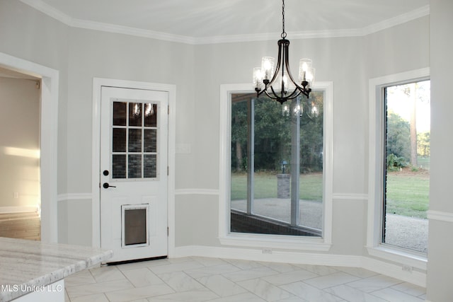 entryway featuring ornamental molding and a notable chandelier