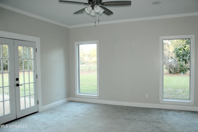 interior space with ceiling fan, light colored carpet, crown molding, and french doors