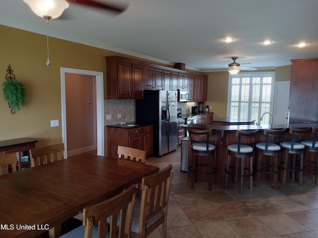 496 Cleveland Crossing Rd, Cleveland, MS 38732 - dining area with a ceiling fan and ornamental molding