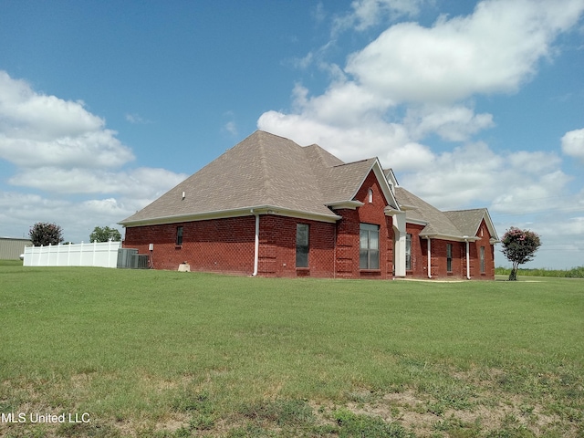 496 Cleveland Crossing Rd, Cleveland, MS 38732 - view of side of home featuring brick siding, a shingled roof, and central AC