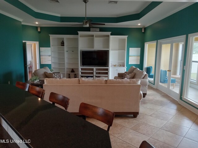 496 Cleveland Crossing Rd, Cleveland, MS 38732 - living room featuring ornamental molding, ceiling fan, light tile patterned floors, a tray ceiling, and recessed lighting