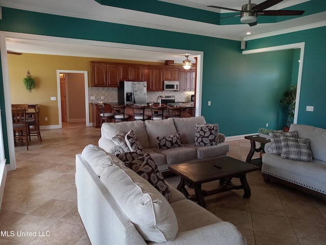 496 Cleveland Crossing Rd, Cleveland, MS 38732 - living area featuring a ceiling fan, ornamental molding, light tile patterned floors, and baseboards