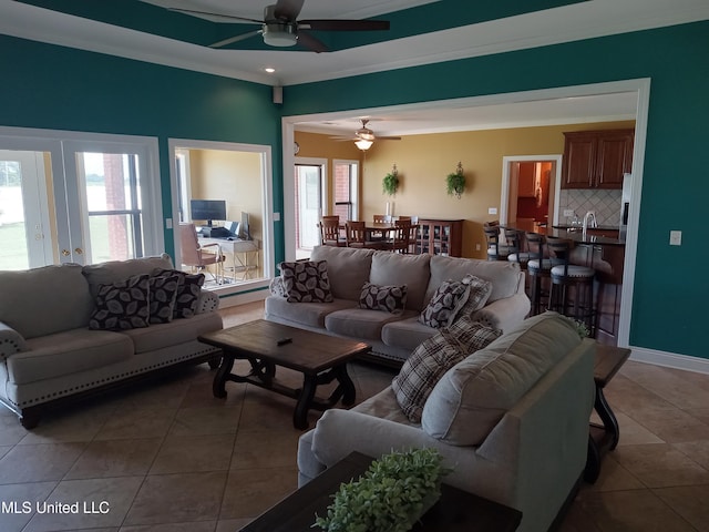 496 Cleveland Crossing Rd, Cleveland, MS 38732 - tiled living area featuring healthy amount of natural light, a ceiling fan, and crown molding