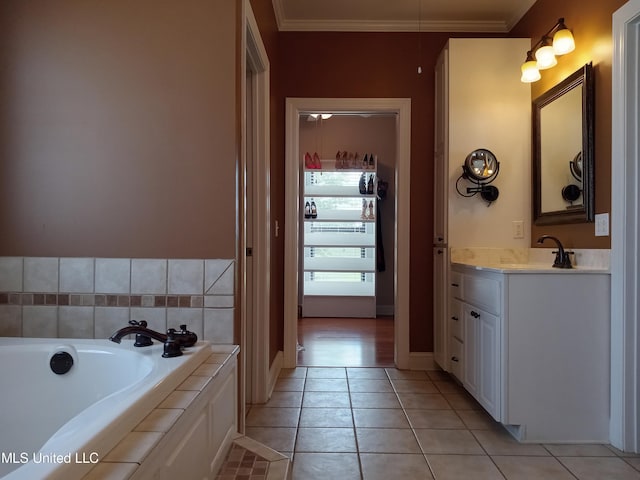 496 Cleveland Crossing Rd, Cleveland, MS 38732 - bathroom with crown molding, tile patterned flooring, vanity, and a bath