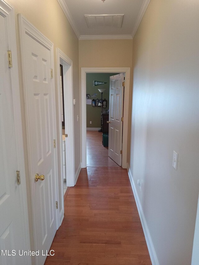 496 Cleveland Crossing Rd, Cleveland, MS 38732 - hall featuring dark wood-style flooring, crown molding, and baseboards