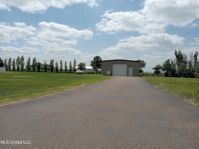 496 Cleveland Crossing Rd, Cleveland, MS 38732 - view of front of property featuring asphalt driveway, a front yard, and an outdoor structure