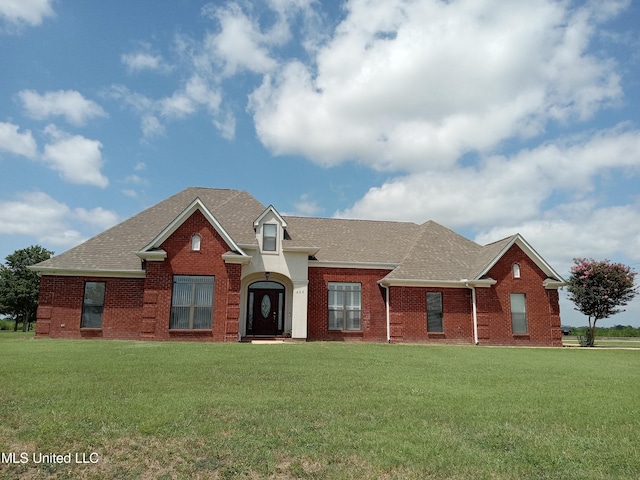 496 Cleveland Crossing Rd, Cleveland, MS 38732 - view of front of property featuring brick siding, a front lawn, and roof with shingles