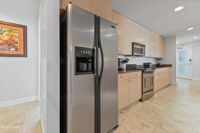 kitchen with baseboards, light brown cabinetry, recessed lighting, light tile patterned flooring, and stainless steel appliances