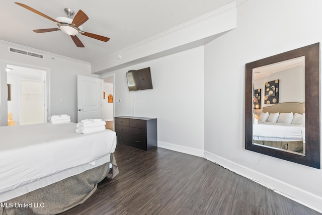 bedroom with a ceiling fan, dark wood-style floors, visible vents, baseboards, and crown molding