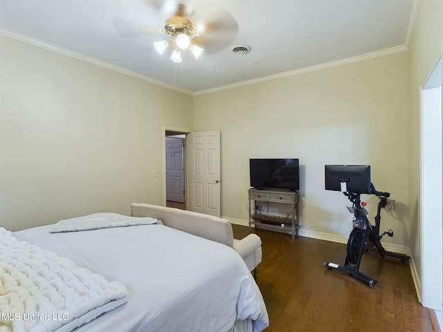 bedroom featuring ceiling fan, dark wood-type flooring, and crown molding