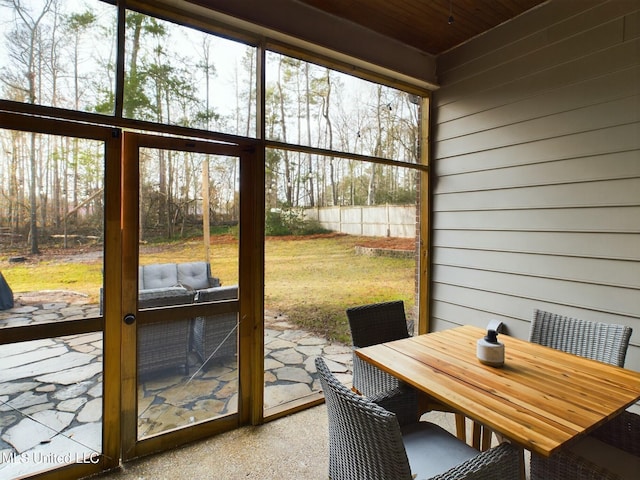 sunroom with wooden ceiling